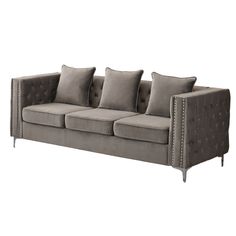 a gray couch with four pillows on it