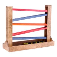 a wooden rack with colored sticks in it