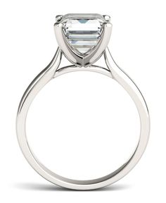 Fill her heart with love and delight with this romantic Moissanite by Charles & Colvard solitaire ring. A spectacular sight in glistening 14K white gold, this remarkable ring boasts a gorgeous 10X8mm emerald cut solitaire stone that sparkles beautifully. This extraordinary ring is sure to sweep her off of her feet. 14k White Gold Jewelry With Classic Cut, White Gold Rings With Asscher Cut And Prong Setting, White Gold Asscher Cut Jewelry With Prong Setting, Fine Jewelry With Classic Cut Center Stone, Asscher Cut White Gold Jewelry With Prong Setting, 14k White Gold Brilliant Cut Classic Jewelry, White Gold Asscher Cut Diamond Ring With Prong Setting, Classic Cut 14k White Gold Jewelry With Prong Setting, Modern Ring With Prong Setting In Classic Cut