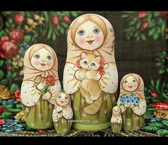 an image of a matry doll with her three children and a cat on it