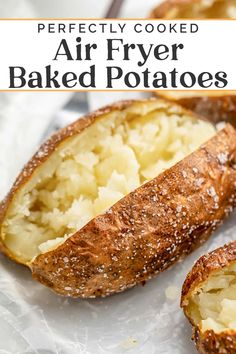 baked potatoes on a baking sheet with text overlay that reads perfectly cooked air fryer baked potatoes