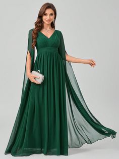 a woman in a long green dress