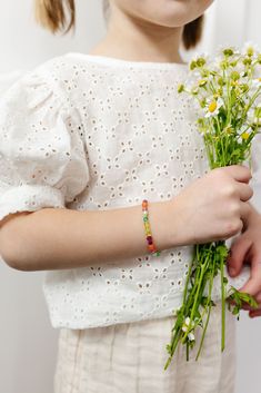 Let's vibe with this beautiful mix! These fun and vibrant colors are sure to be an eye catcher. From the deep magenta to the soft light green. This bracelet is sure to be a bold statement with your everyday pieces. The perfect accessory for every little girl! Made with the highest quality materials, this bracelet will look beautiful for years to come. Durable enough for play, precious enough to keep forever. Materials: 14k gold filled or sterling silver components. Nickel free. To learn more abo Green Flower Beaded Bracelets For Beach, Bohemian Round Beads Bracelets For Spring, Bohemian Spring Bracelets With Round Beads, Bohemian Beaded Bracelets For Everyday Spring Wear, Bohemian Beaded Bracelets For Spring, Multicolor Bohemian Bracelet For Spring, Adjustable Colorful Beads Friendship Bracelets For Spring, Adjustable Rainbow Beaded Bracelets For Spring, Spring Beach Bracelets With Letter Beads