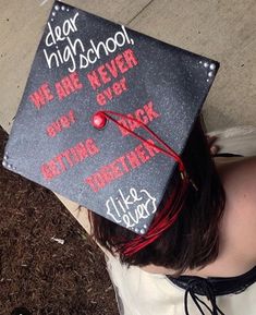 a woman wearing a graduation cap that says dear high school, we are never getting back together