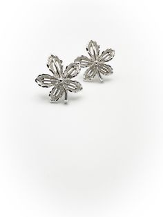 Lovely pair of vintage leaf earrings from costume jewelry designer Sarah Coventry! Silver tone metal. Backings are clip on style. Signed on the back of the leaves and along the clips. Overall good condition. Minor wear. Free of rust and verdigris. 1 and 1/8 inches tall and 1 inch wide. Discounts offered for bulk purchases. Shop accepts PayPal, credit cards, and Etsy gift cards. ♥Check out the rest of the shop♥ https://www.etsy.com/shop/artdecodame *Return Policy* I do accept returns. I do not cover the cost of return shipping. International orders have a 30 day return window, domestic orders have 7 days from date of delivery. Item must be returned in original condition. In the unfortunate occurrence of item arriving damaged please reach out to me so that we can work out a solution. Formal Silver Flower-shaped Clip-on Earrings, Metal Leaves, Sarah Coventry, Jewelry Designer, Coventry, Leaf Earrings, Gold Tone Metal, Gift Cards, Credit Cards