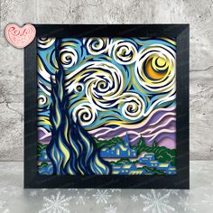 the starry night painting is displayed in a black frame