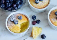 blueberries and other desserts on a table