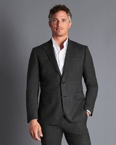 Super 120's woolmark certified pure merino wool, Natural stretch and crease recovery, Available in classic and slim fit, Body Lining: Exclusive Charles Tyrwhitt Lapwing 52% polyester, 48% viscose lining in chocolate, AMF stitching along notch lapel and flap pockets for a timeless finish, Half-canvas construction, Straight flap pockets, chest pocket and internal jet pockets, Four-button working cuff with corozo nut buttons, Dry clean only - Ultimate Performance Birdseye Suit Jacket - Grey | Men's Fitted Long Sleeve Tweed Jacket For Business, Luxury Slim Fit Blazer For Business Casual, Modern Slim Fit Suit, Slim Fit Wool Suit With Long Sleeves, Slim Fit Wool Suits With Long Sleeves, Modern Wool Suit With Long Sleeves, Modern Long Sleeve Wool Suit, Wool Business Suits With Long Sleeves, Wool Business Suits