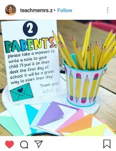 there are many pencils in a cup on the table next to a sign that says parents