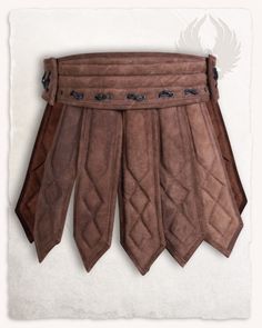 a brown leather skirt hanging on the wall