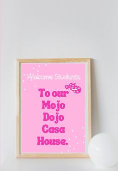 a pink sign that says welcome students to our mojo dojo casa house