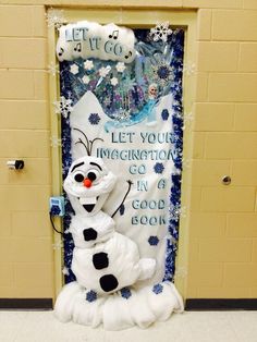 a frozen princess door decorated with frosting and snowman's head, saying let it go