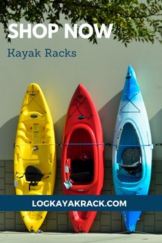 three kayaks lined up against a wall with the words boat, kayak and bike rentals