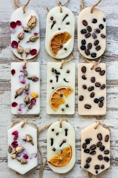 soaps decorated with dried fruit and nuts are hanging on twine strings, which also have tags attached to them