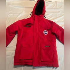 Mens Canada Goose Coat Size Medium Red Parka With Pockets For Outdoor, Red Outdoor Parka With Pockets, Red Outdoor Sport Coat With Pockets, Red Sport Coat With Pockets For Outdoor, Casual Red Parka With Pockets, Canada Goose Coat, Canada Goose Mens, Canada Goose, Canada Goose Jackets