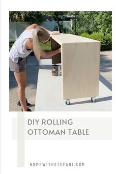 a woman is painting the bottom of a wooden table with text overlay that reads diy rolling ottoman table