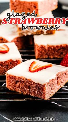 strawberry brownies with white frosting and strawberries on top