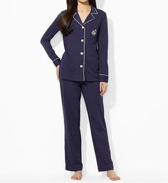 Classic pajamas are tailored from an extra soft knit of cotton and modal for luxurious comfort. Set includes traditional pajama top and matching bottoms. Top has an open notch collar outlined with piping. Four button front. Long sleeves end in cuffs with piped trim. Pocket with embroidered Lauren monogram on left chest. Straight hem. Bottoms have non-stretch front waist with covered elastic at back for comfortable flexing fit. Drawstring ties at front of waist adjust fit. Lightweight knit is com Blue Pajamas, Cute Pjs, Classic Pajamas, Top And Pants Set, Notch Collar, Ralph Lauren Womens, Pajama Top, Pj Sets, Double Breasted Suit Jacket