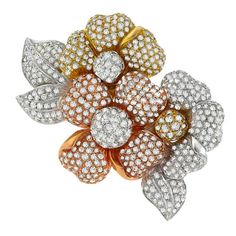 Made of 18k white, yellow and rose gold, this pin features sparkling round cut diamonds weighing approximately 15.00ct. The color of the diamonds is F-G with VS1 clarity. The pin measures 56mm by 67mm and is stamped 750. Inventory #92615RSSS Brooch Diamond, Jewelry Making Business, Yellow Jewelry, Floral Pins, Gold Brooch, Floral Brooch, Cubic Zirconia Jewelry, Diamond Brooch, Expensive Jewelry