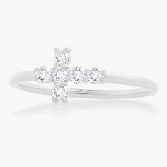 Our Little Grace Diamond Cross Ring is a twinkling token of faith. The intentional delicacy of this design makes for the heartfelt gift of a child's first piece of fine jewelry or an adult's everyday dainty wear. Metal: 18k White Gold / 18k Yellow Gold / 18k Rose Gold 6 Round Brilliant Cut Natural Diamonds: Approx. 0.24 ctw G/H Color and SI1-2 Clarity Diamonds White Sterling Silver Stackable Rings With Prong Setting, Dainty White Brilliant Cut Stackable Rings, White Brilliant Cut Dainty Stackable Rings, Dainty White Stackable Rings With Brilliant Cut, Dainty White Sterling Silver Diamond Ring, White Sterling Silver Stackable Rings With Brilliant Cut, College Rings, Mens Engagement, Diamond Cross