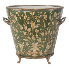 a green and gold flower pot with handles