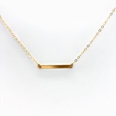 Trendy skinny bar in petite form to complete your minimalist style. Our materials make for an amazing, quality piece of jewelry, made with 14K gold filled chain and a bar. 14K gold filled chain 14K gold filled bar bar is 3 x 25 mm Bar Station Necklace, Minimalist 14k Yellow Gold Bar Necklace, Gold Bar Necklace With Adjustable Chain And Rectangular Pendant, Gold Dainty Bar Necklace With Cable Chain, Gold Bar Necklace With Rectangular Pendant For Everyday, Simple Bar Necklace With Delicate Chain, Simple Everyday Bar Necklace With Delicate Chain, Dainty Gold Bar Necklace With Cable Chain, Simple Gold Bar Necklace With Delicate Chain