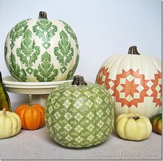 pumpkins and gourds are sitting on a table with the words country living inspired