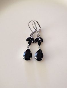 "Pretty pair of earrings featuring crystals in jet black. 1 1/2\" long. Thanks for stopping by!" Black Teardrop Crystal Earrings For Formal Events, Black Dangle Chandelier Earrings For Wedding, Formal Black Teardrop Crystal Earrings, Black Prom Jewelry, Blush Necklace, Crystal Cluster Earrings, Black Crystal Earrings, Black Drop Earrings, Black Bridesmaid