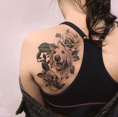 a woman with a dog and roses tattoo on her upper back shoulder is looking at the camera