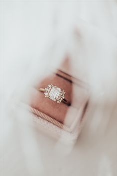 While listening to the song "1922", by the band Box the Oxford, Sarah was inspired to create this amazing collection. So of course, we had to name a ring after them! Our Oxford 14k gold ring rocks a vintage vibe while being thoroughly modern. The brilliant emerald cut 1 ct center stone sets the architectural tone, while the .17 ct tapering side baguette and round diamonds make this stunner truly sing. Emerald Ring With Baguette Diamonds And Asscher Cut, Fine Jewelry Diamond Ring For Proposal With Baguette Cut, Diamond Baguette Cut Emerald Ring For Proposal, Baguette Cut Emerald Ring With Diamond For Proposal, Heirloom Emerald Cut Diamond Ring For Proposal, Radiant Cut Diamond Ring With Baguette Diamonds, Proposal Rings With Diamond Accents And Baguette Cut, Luxury Baguette Cut Diamond Ring With Accent Stones, Baguette Cut Diamond Accent Proposal Ring