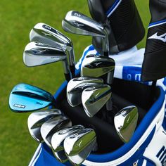 the golf clubs are ready to be put into their bag