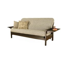 a futon sofa with two pillows on it and a tray for the end table