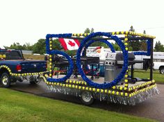 a truck is decorated with blue and yellow decorations