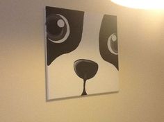 a dog's face is painted on the wall