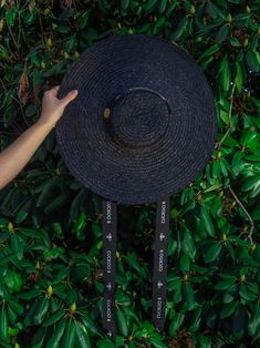 This handwoven wheat straw boater hat is handmade by Portuguese artisans, using traditional millinery techniques. Its round shape, flat cap, and wide brim makes it the perfect accessory to wear centered or at an angle on the head. It features a thick black gross-grain ribbon with the Cuckoo B logo and metal bee, intended to be worn knotted under the chin. It is the perfect accessory for a special daytime event, or even for a day at the beach or countryside. Material: Wheat straw, gross-grain rib Metal Bee, Straw Boater Hat, Straw Boater, B Logo, Boater Hat, Wheat Straw, Flat Cap, Wide Brimmed, Floppy Hat