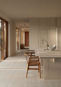 an instagram photo of a kitchen and dining room with wood paneling on the walls