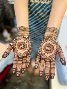 a woman's hands with hennap on it, showing the intricate design