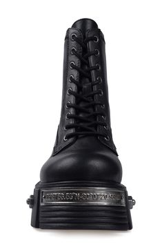 Bring bold biker edginess to your footwear collection with this heavy-duty combat boot set upon a lugged platform sole studded with rivet-style screws, bolts and a numbered plaque. 4" heel; 3 1/2" platform 6" shaft Lace-up style Water resistant Leather upper and lining/rubber sole Imported Punk Style Platform Boots With Studded Outsoles For Streetwear, Leather Studded Platform Boots For Streetwear, Leather Platform Boots With Studs For Streetwear, Gothic Lace-up Boots With Lug Sole For Streetwear, Alternative Leather Combat Boots With Metal Feet, Leather Combat Boots With Metal Feet In Alternative Style, Alternative Style Leather Combat Boots With Metal Feet, Punk Moto Boots With Studs For Streetwear, Edgy Steel Toe Leather Combat Boots