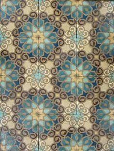 an old tile floor with blue and brown designs