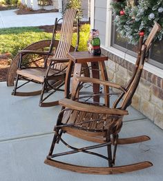 two rocking chairs sitting on the front porch