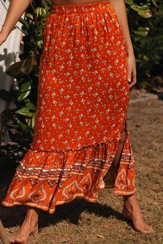 Multicolor Floral Print Maxi Skirt Bohemian Midi Skirt For Day Out, Summer Orange Maxi Skirt With Elastic Waistband, Bohemian Orange Floral Print Skirt, Flowy Orange Maxi Skirt With Elastic Waistband, Orange Floral Print Long Skirt, Orange Floral Print Skirt, Orange Ruffled Skirt For Summer, Chic Orange Floral Print Skirt, Summer Orange Ruffled Skirt