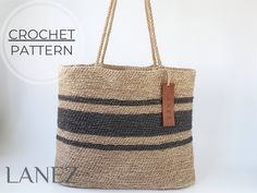 an image of a bag that is made out of rope and has a leather tag on it