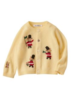 a child's sweater with embroidered figures on it