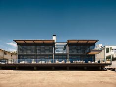 a large house with lots of windows on top of it's roof and side walls