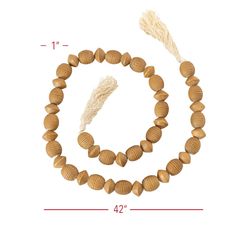 the beaded bracelet is made from wood beads and has a tassel on it