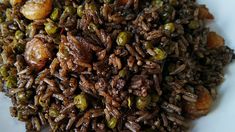 rice and peas are mixed together on a plate