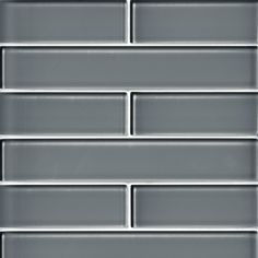 a close up view of a gray brick wall with white lines on the bottom and sides