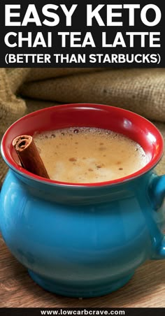 a blue bowl filled with tea and cinnamon sitting on top of a wooden table next to a