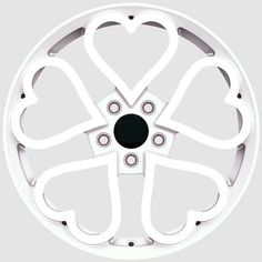 a white wheel with hearts on the center and two holes in the middle that are cut out