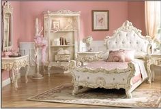 a bedroom with pink walls and white furniture